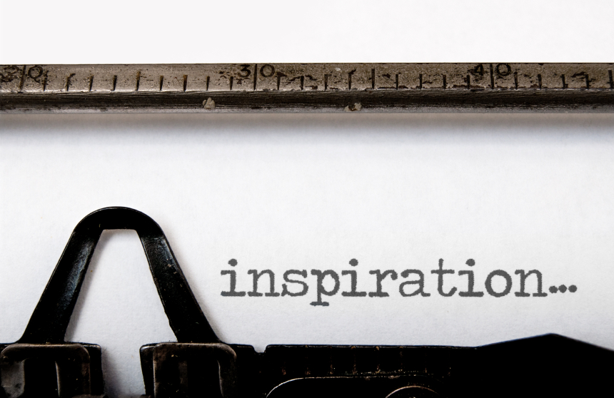 The word inspiration written on a vintage typewriter